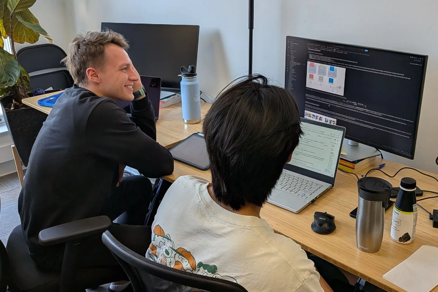 Two participants working together at a desk