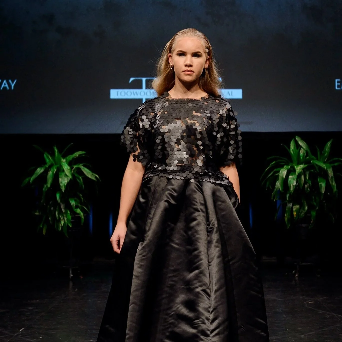 Nicole McNiven Corr brings a bold, modern twist to the classic Little Black Dress. Her collection fuses timeless elegance with fresh silhouettes, empowering women to feel confident and unforgettable at any event.

Photo: Theresa Hall. Model: Zavannah