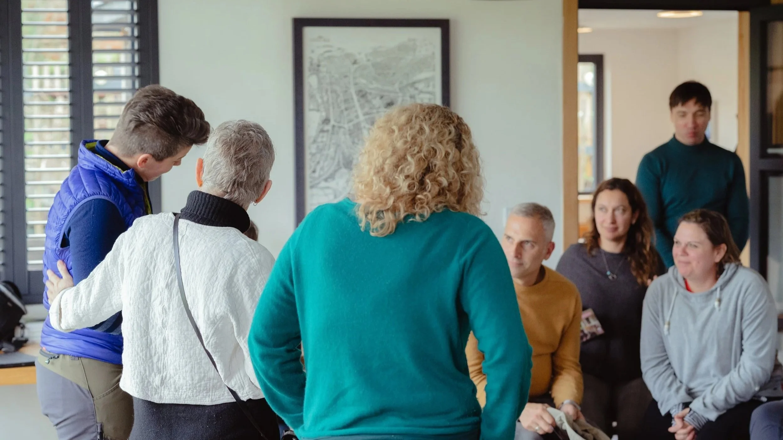 leaders walking and talking side by side in nature, exploring team dynamics and leadership pace through outdoor executive coaching.