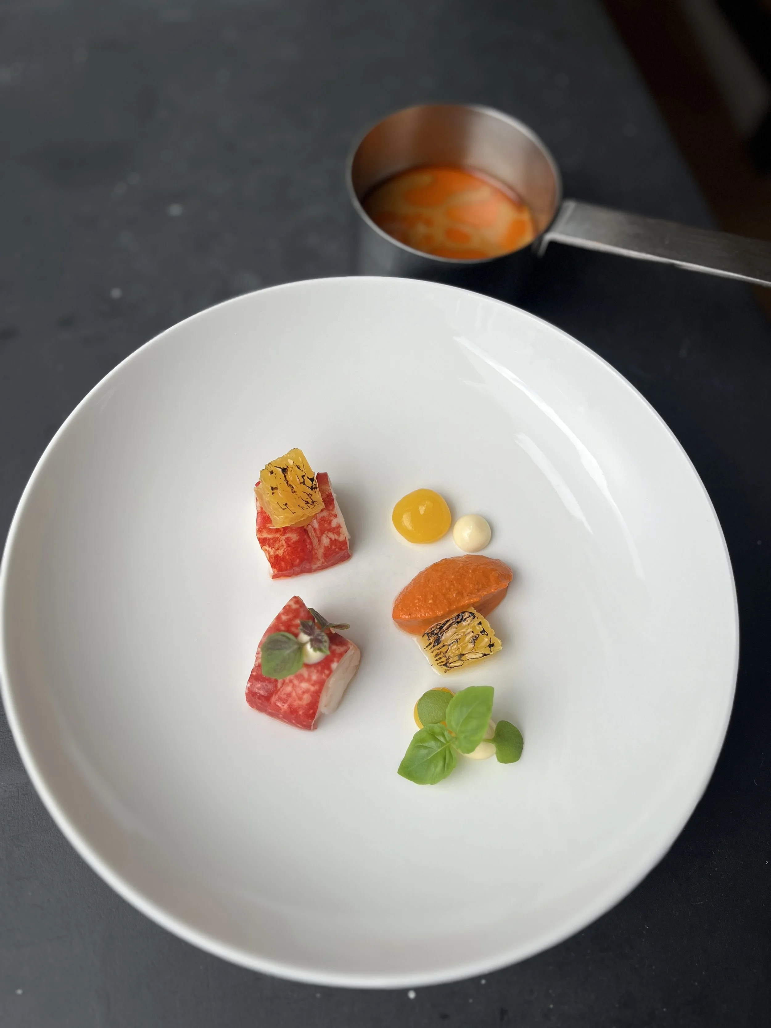 Lobster, romesco, orange, bisque