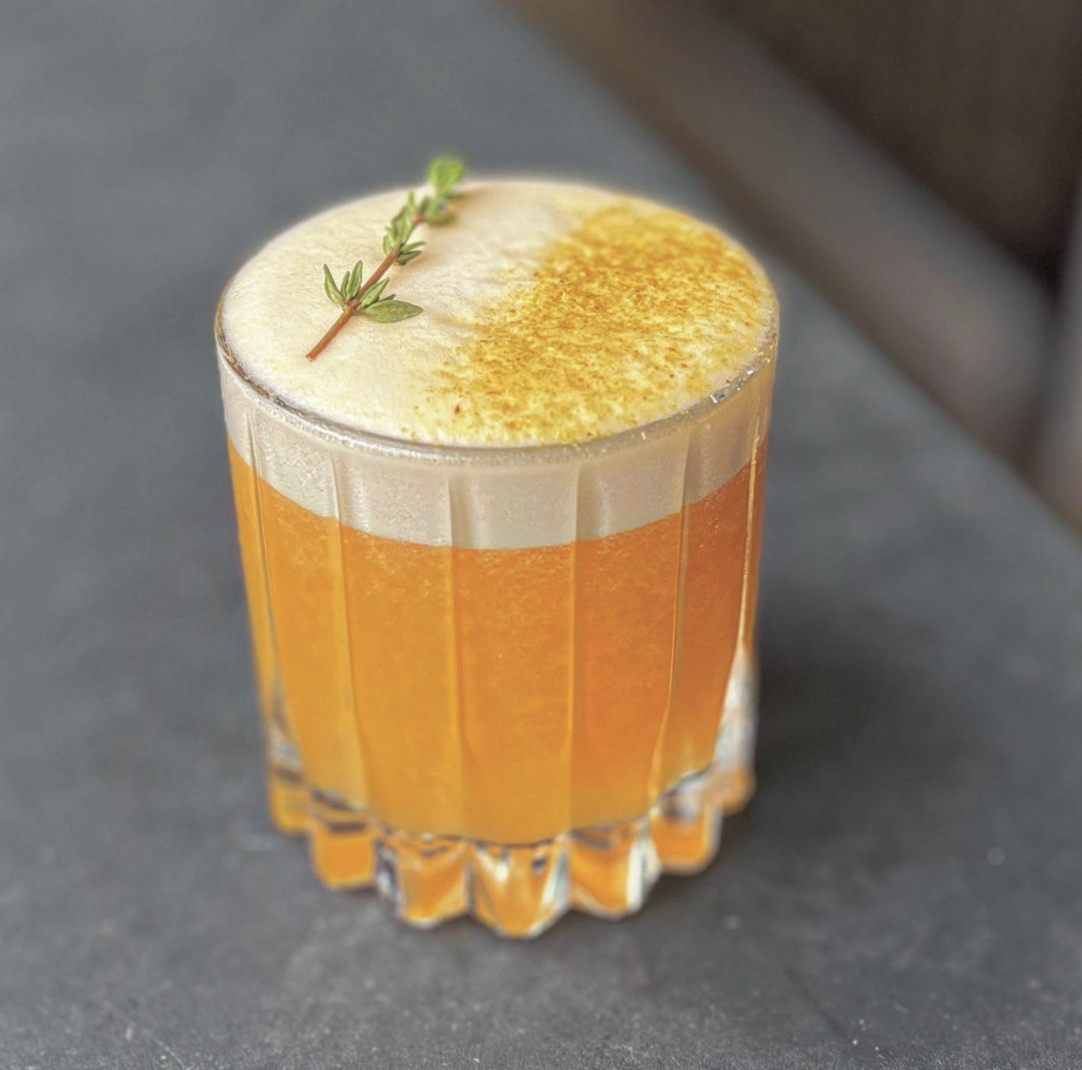 Non-alcoholic apricot and thyme sour cocktail