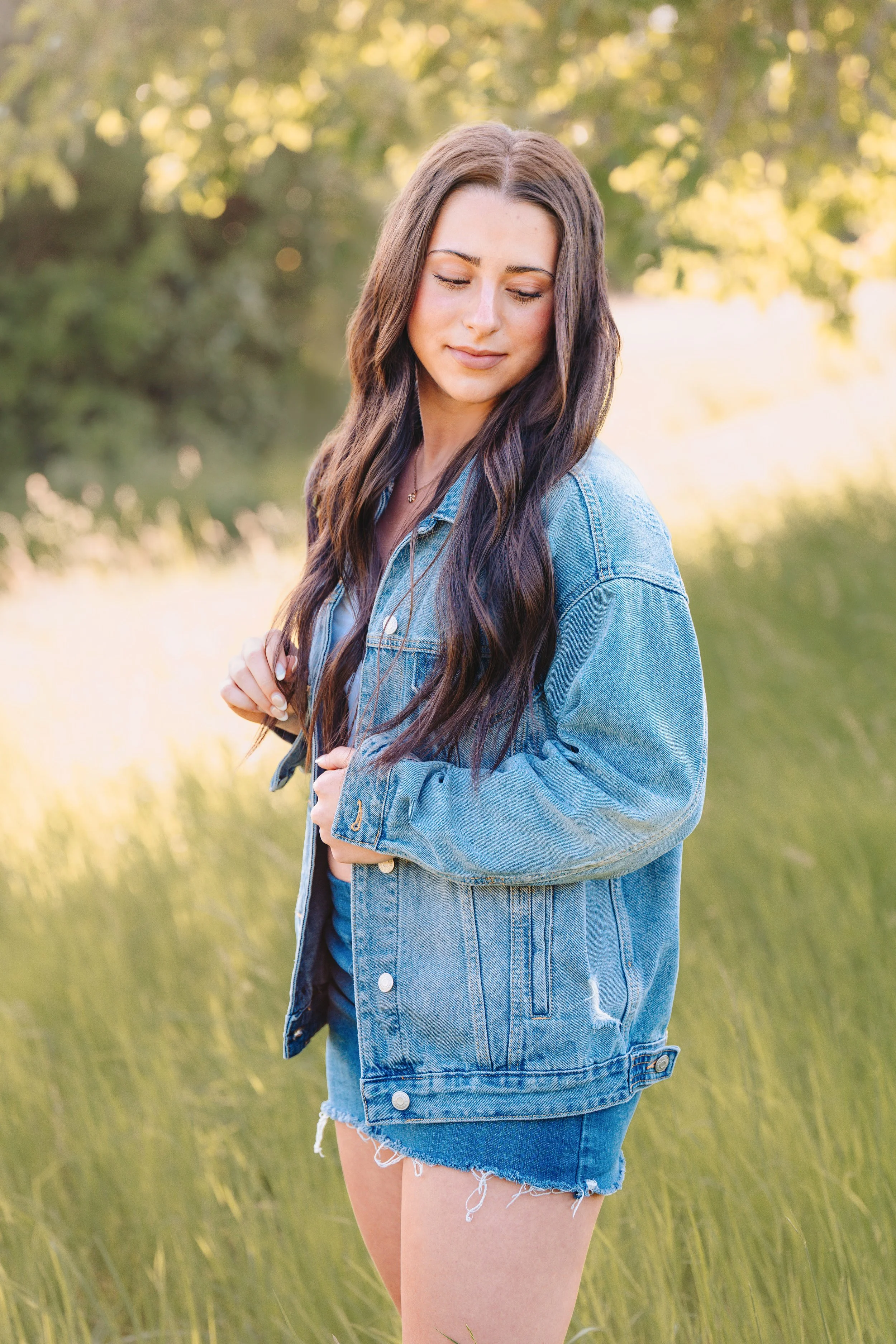 Senior girl in grassy field