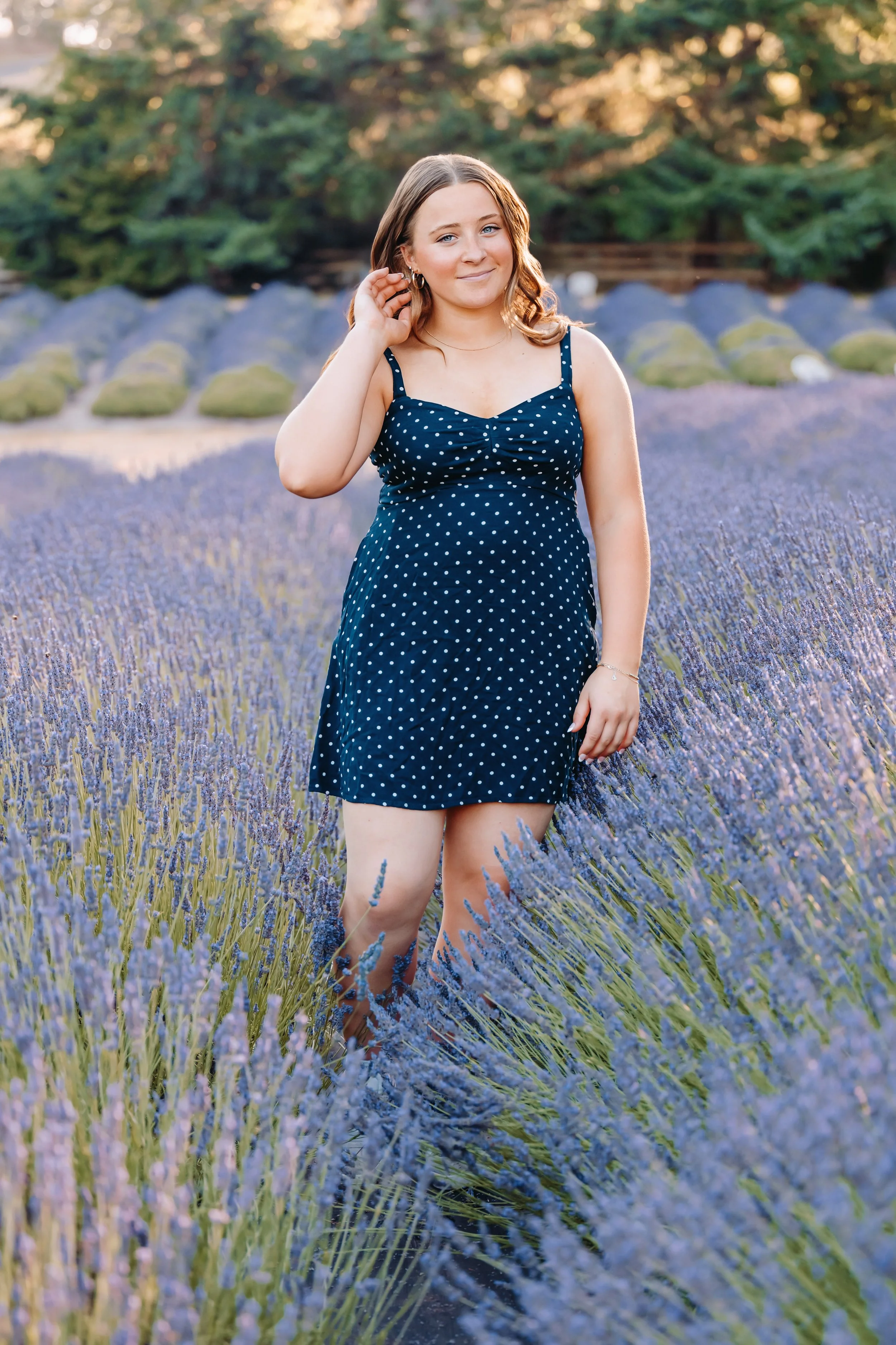 Senior girl at lavender field in Newberg, Oregon smiling at camera