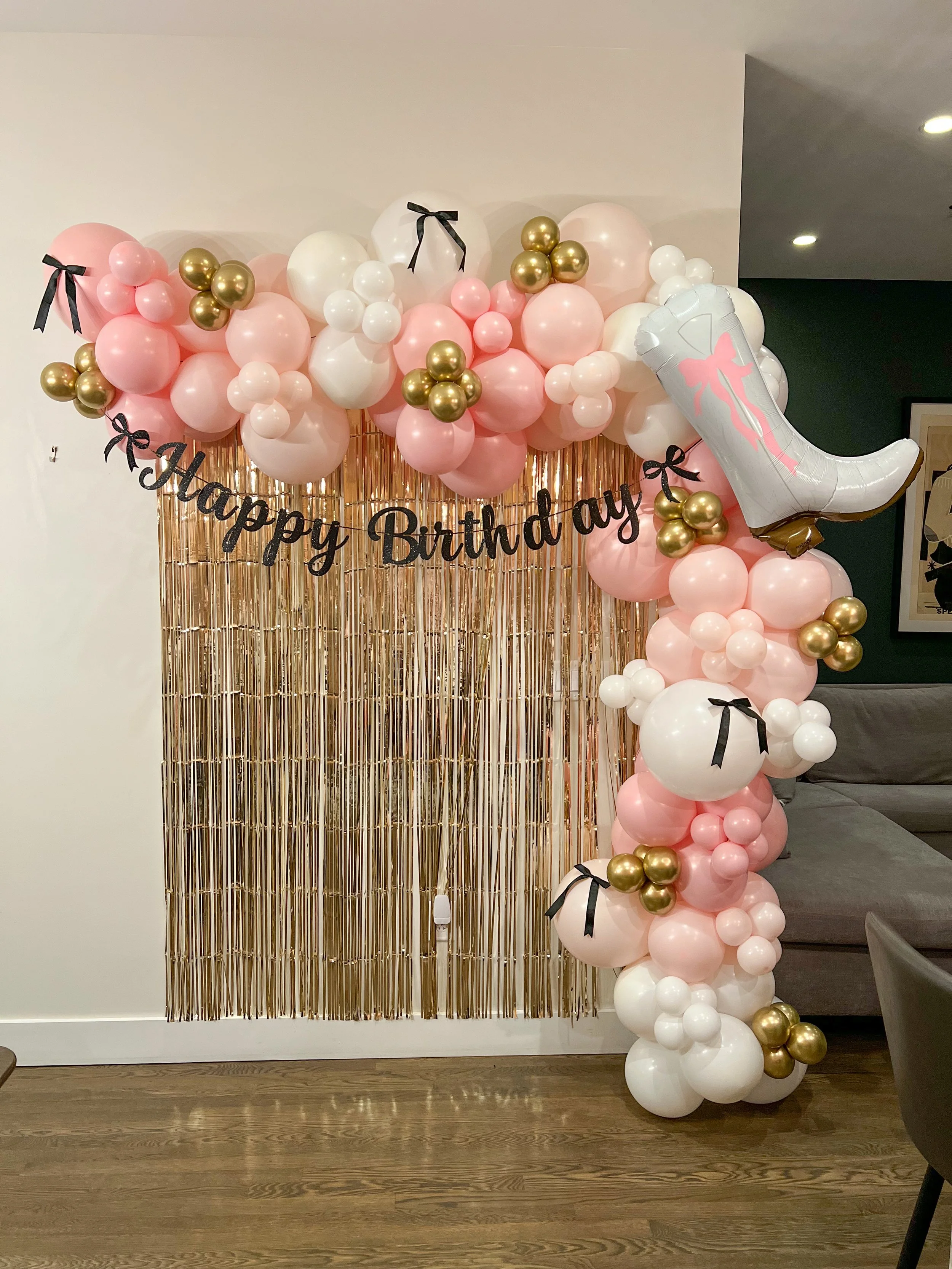 balloon garland backdrop boots and bows
