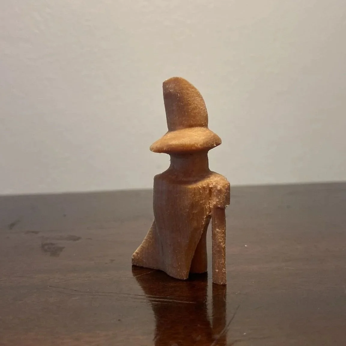 Clak, clak, clak, his staff echoed down the whitewashed chalky hallway, quickly gaining on the large fading doors at the terminus. Tick, tick, tick the guildhall clock quietly murmured whilst the grit from the wobbly parquet floor, ground under the b