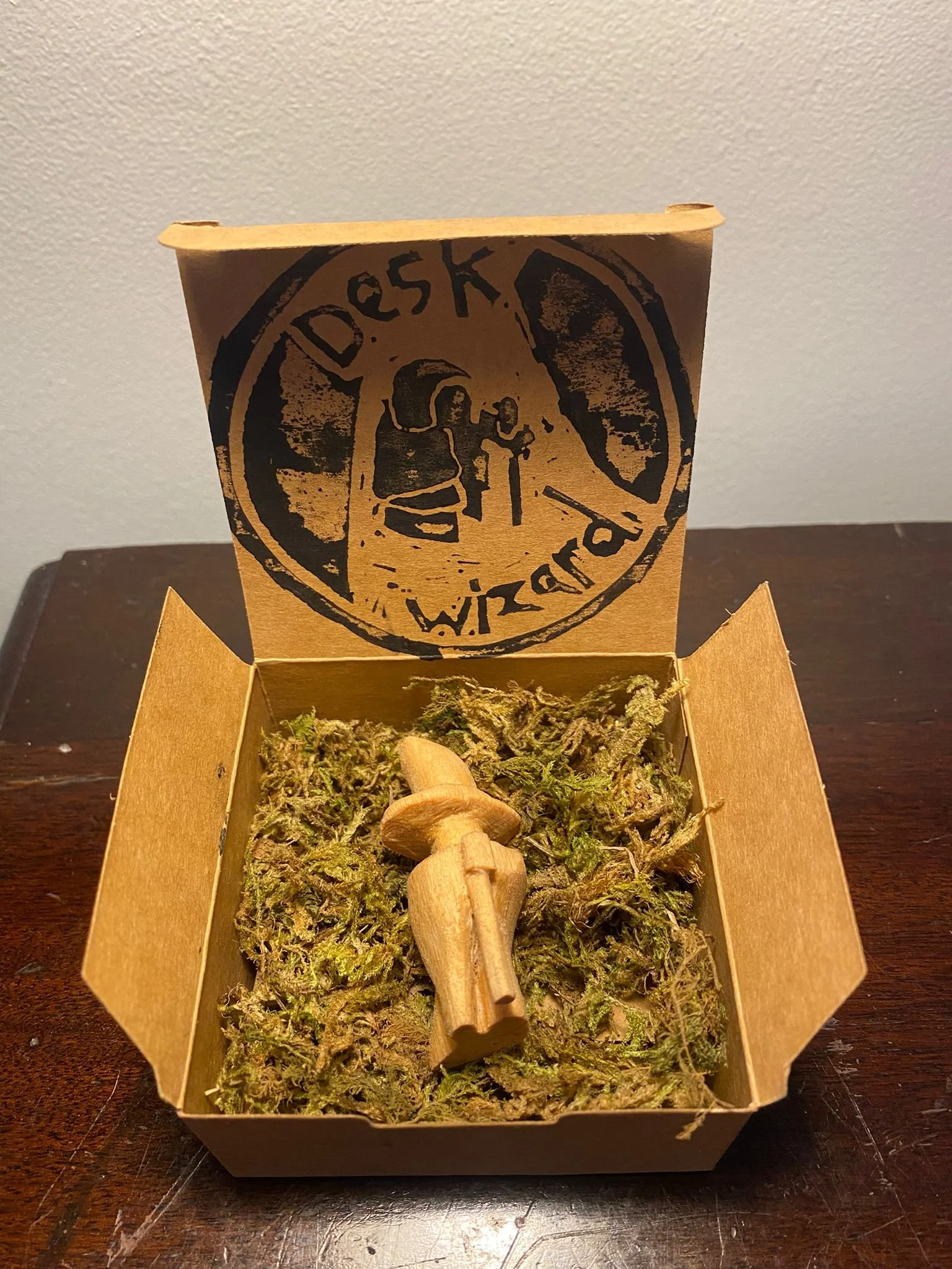 I have a series of wooden miniature sculptures of wizards which was inspired by the idea of rubber duck debugging.
I call these sculptures Desk Wizard's,
you will see a sample of three below 