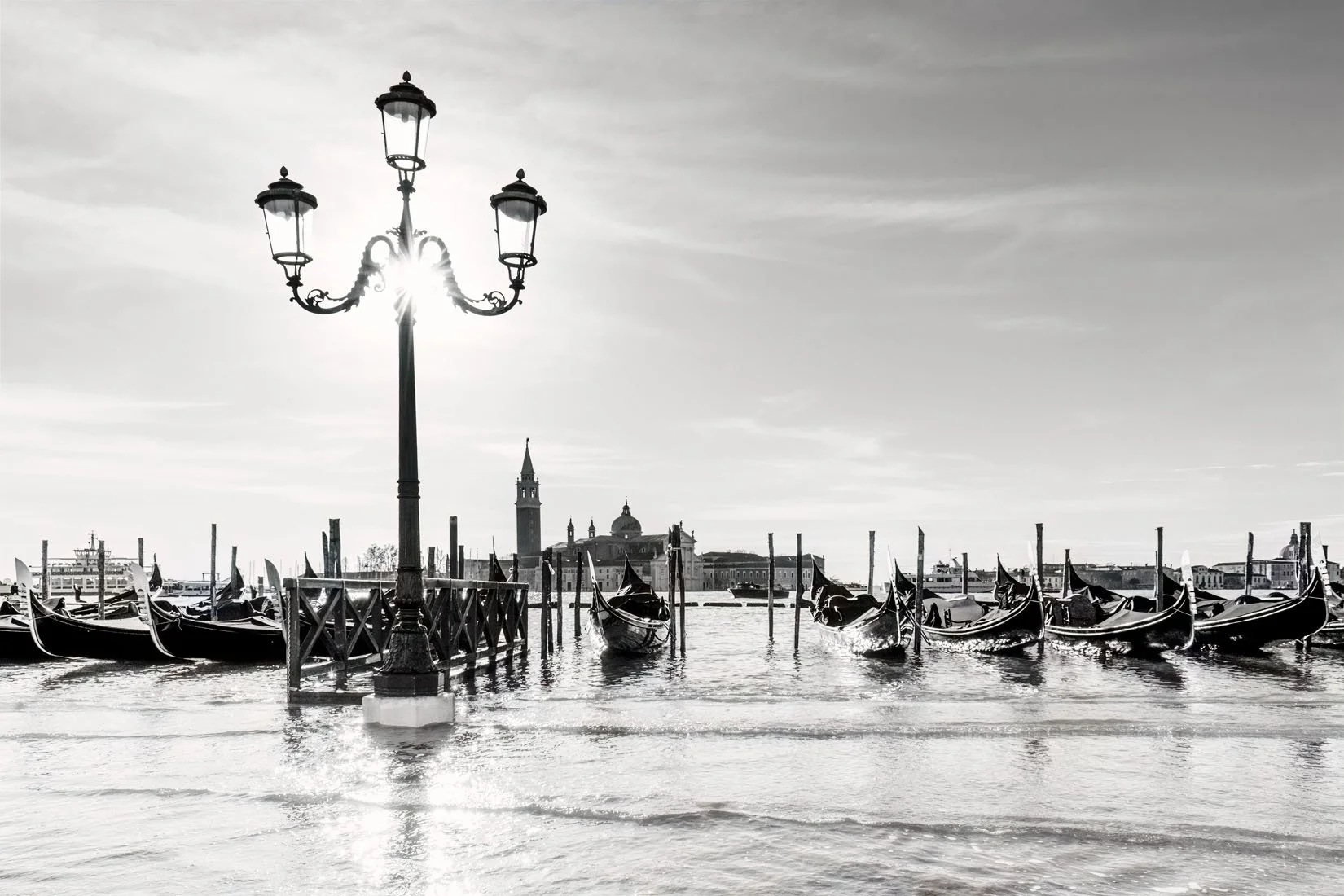 Gondola station at San Marco during Acqua Alta, with San Giorgio Island in the background | Lo stazio delle gondole a San Marco durante l’acqua alta, sullo sfondo San Giorgio
