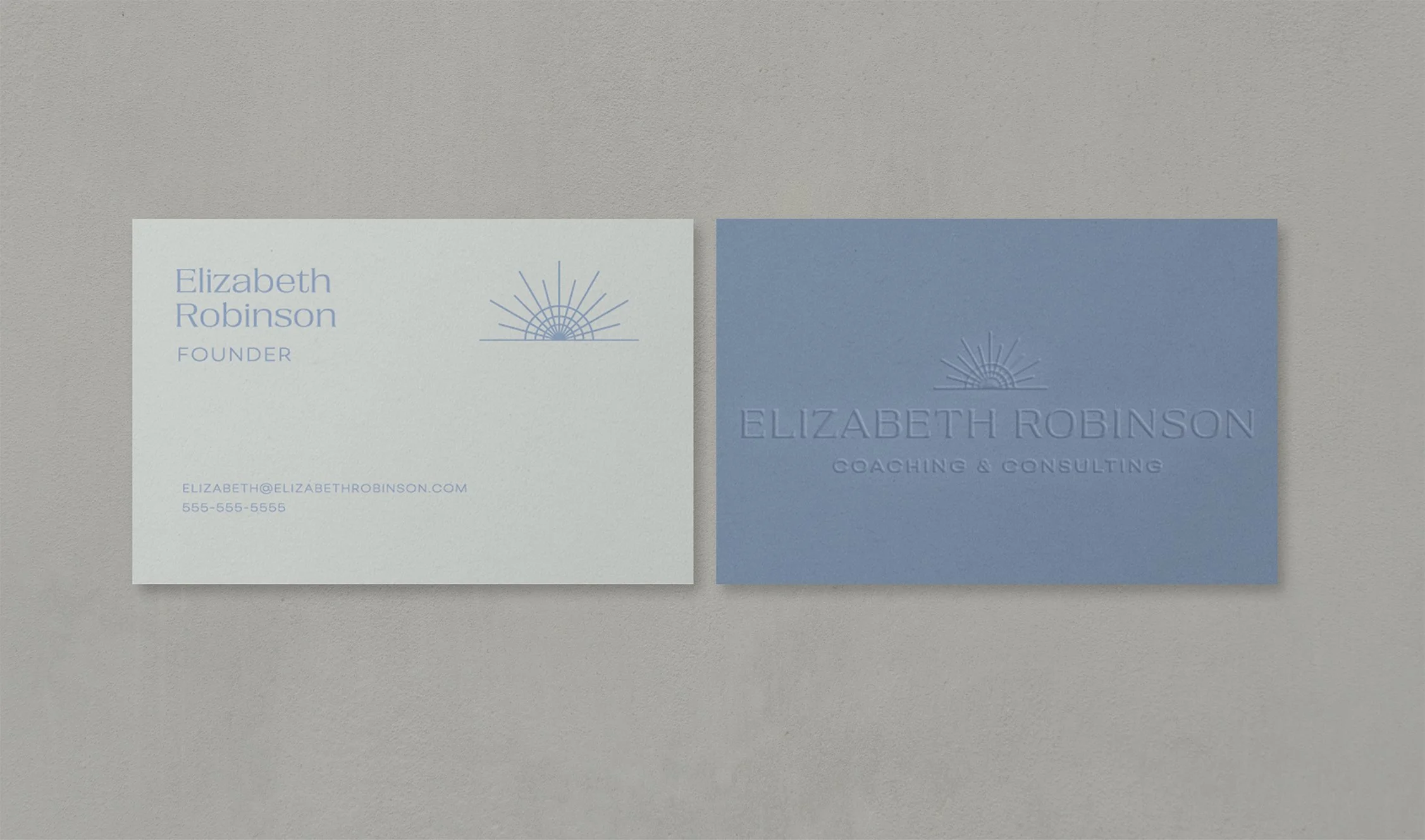 Mockup of front and back of business card with Elizabeth Robinson Coaching & Consulting brand against a gray background