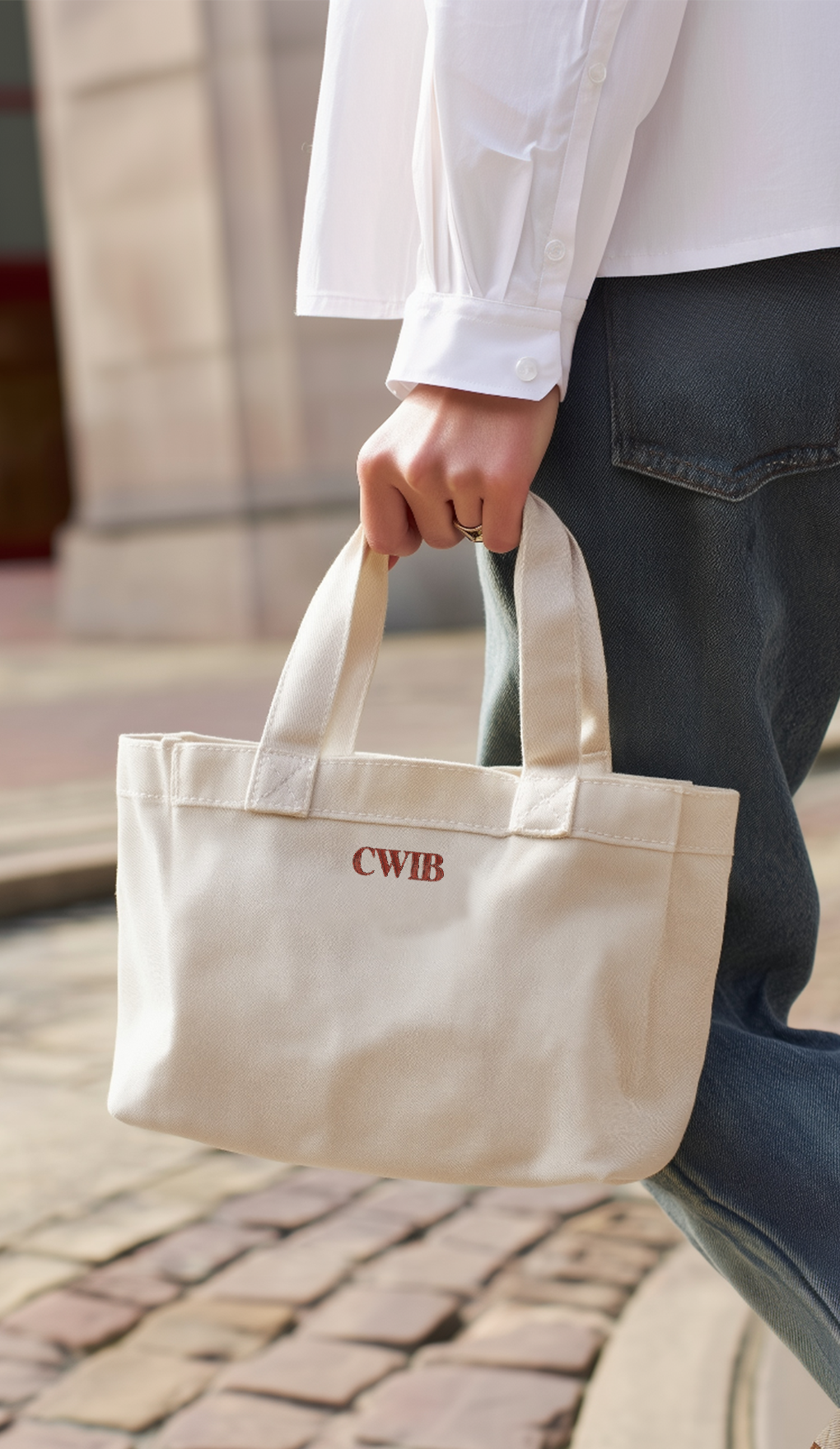 Mockup of CWIB logo stitched onto a book tote