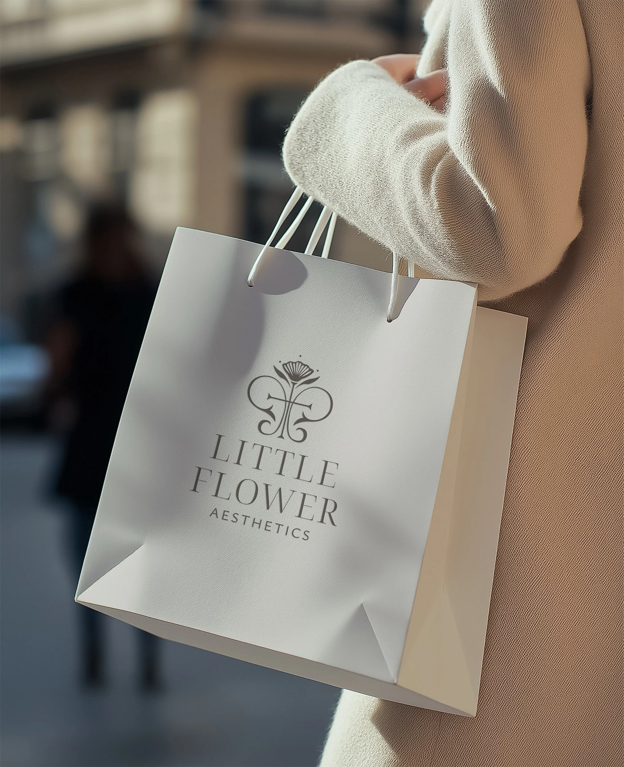 Little Flower Aesthetics logo on a shopping bag mockup