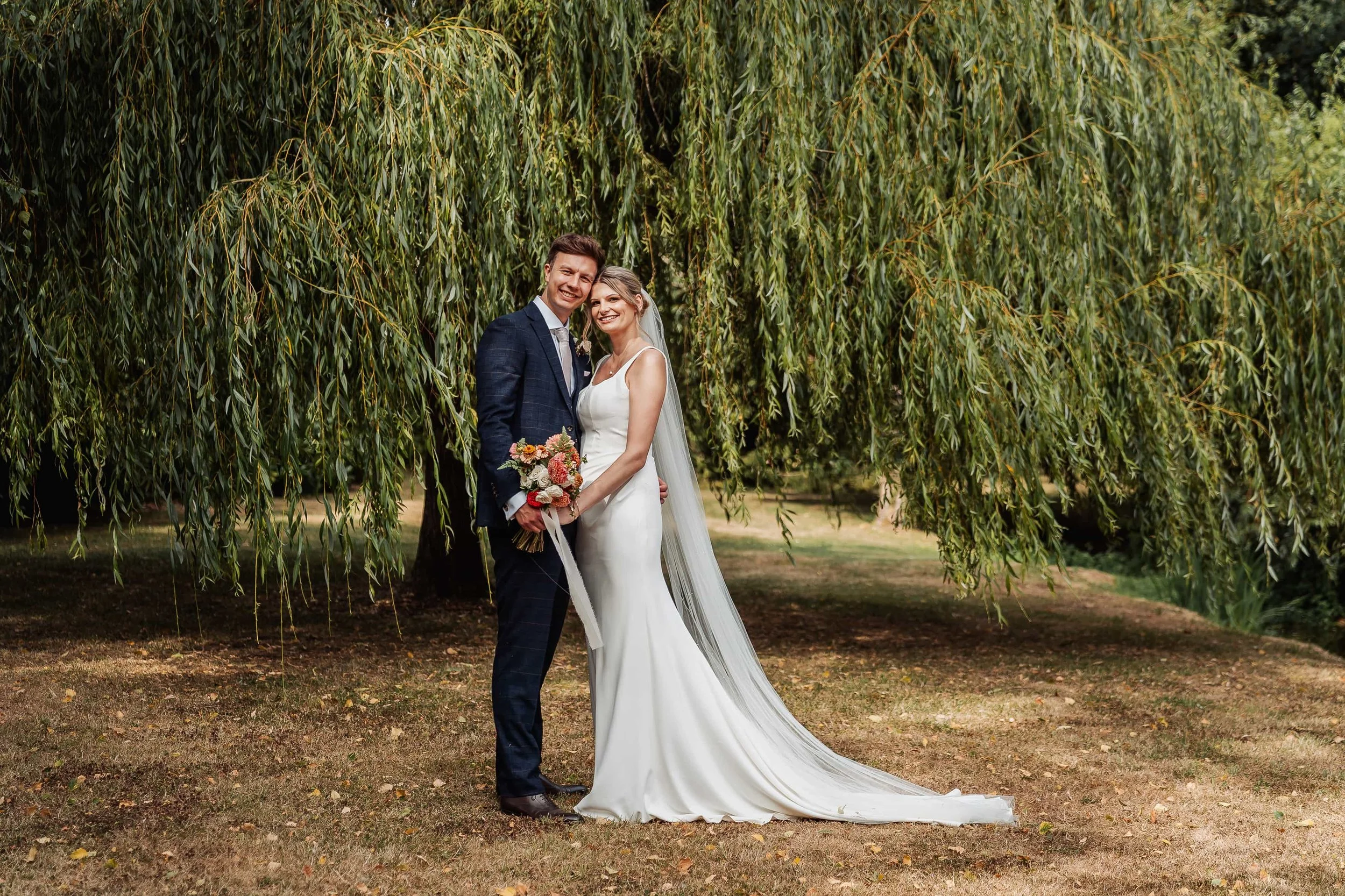 744_bride-groom-embrace-willow-tree-wedding-portrait.jpg