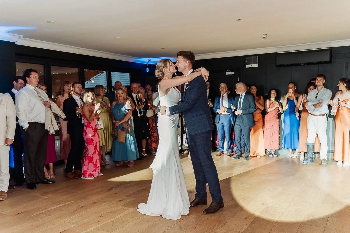 bride and groom first dance at waters edge