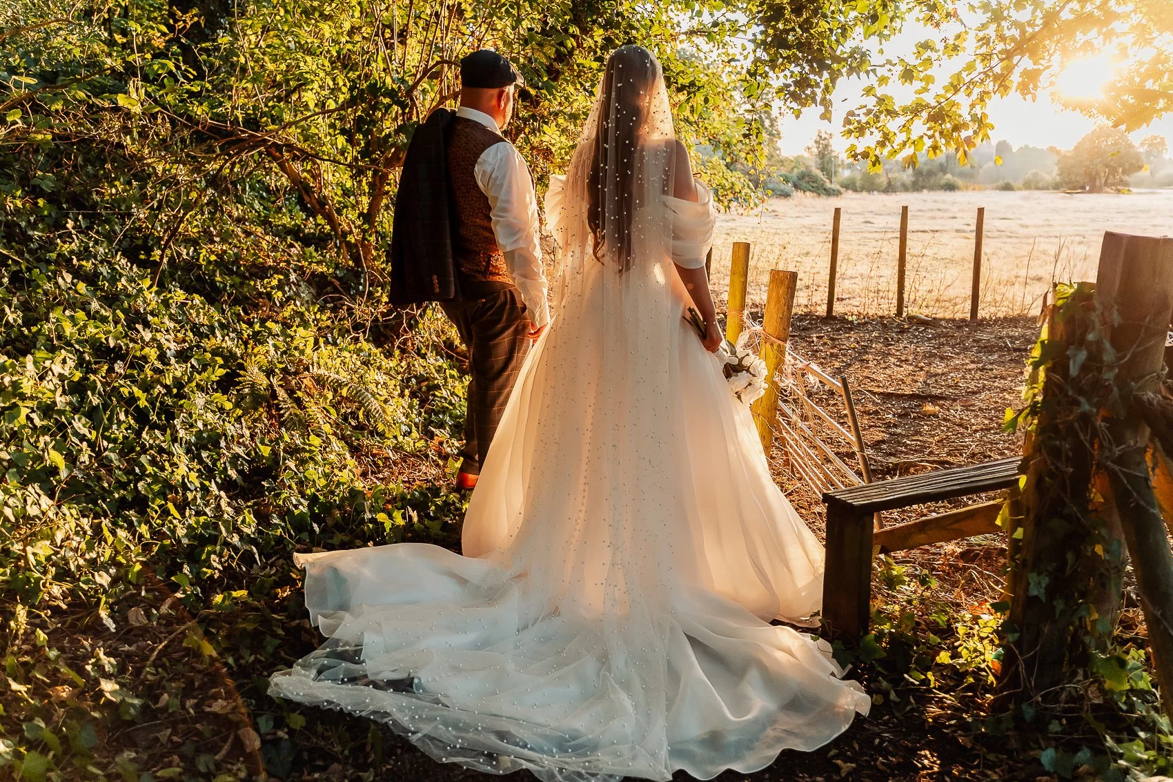030-cadbury-house-wedding-couple-sunset-field-gate.jpg