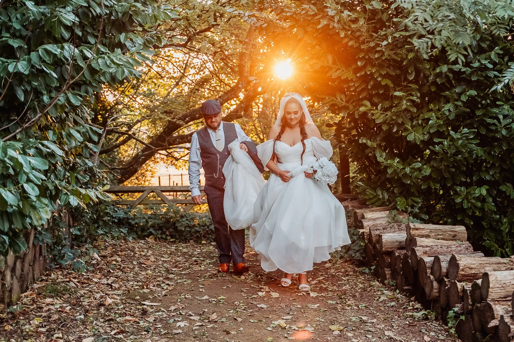 033-cadbury-house-wedding-couple-woodland-sunburst.jpg