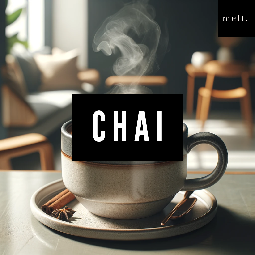 Chai candle by Melt, surrounded by elements representing its warm and spicy fragrance.