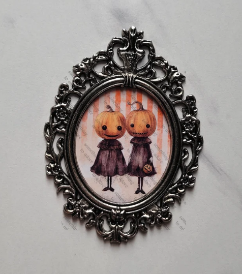 Tiny baroque framed pumpkin heads