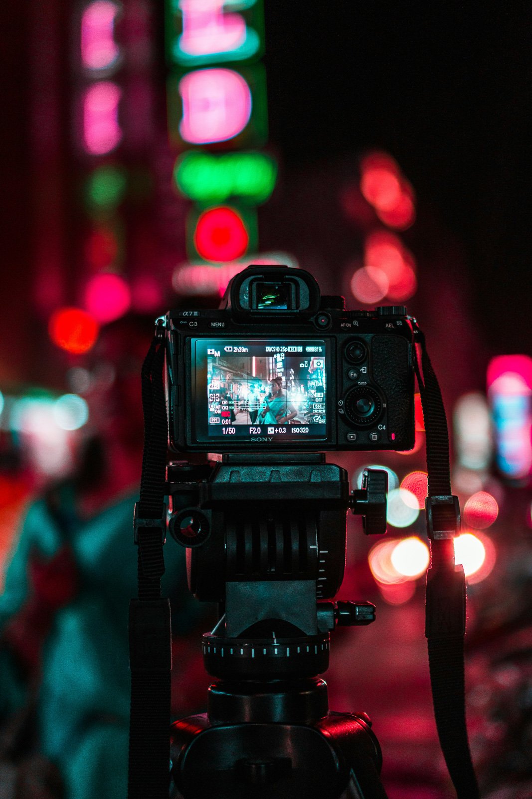 camera taking portrait at night with bokeh background