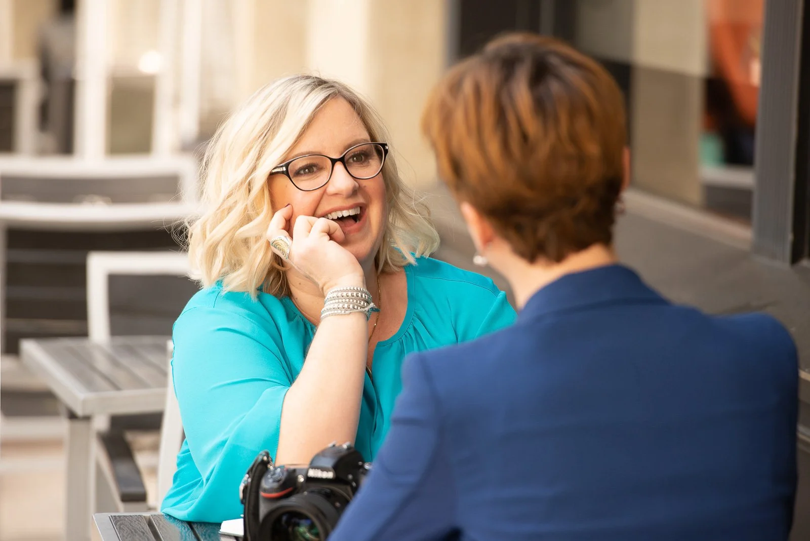 Stephanie Simpson talks with client in Glendora about brand