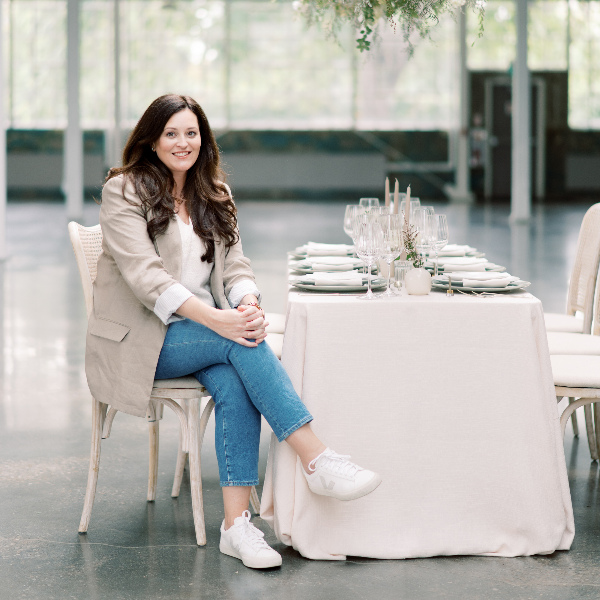 Wed Well Showcase founder Krista Olynyk sitting in SAIB event space in Mississauga