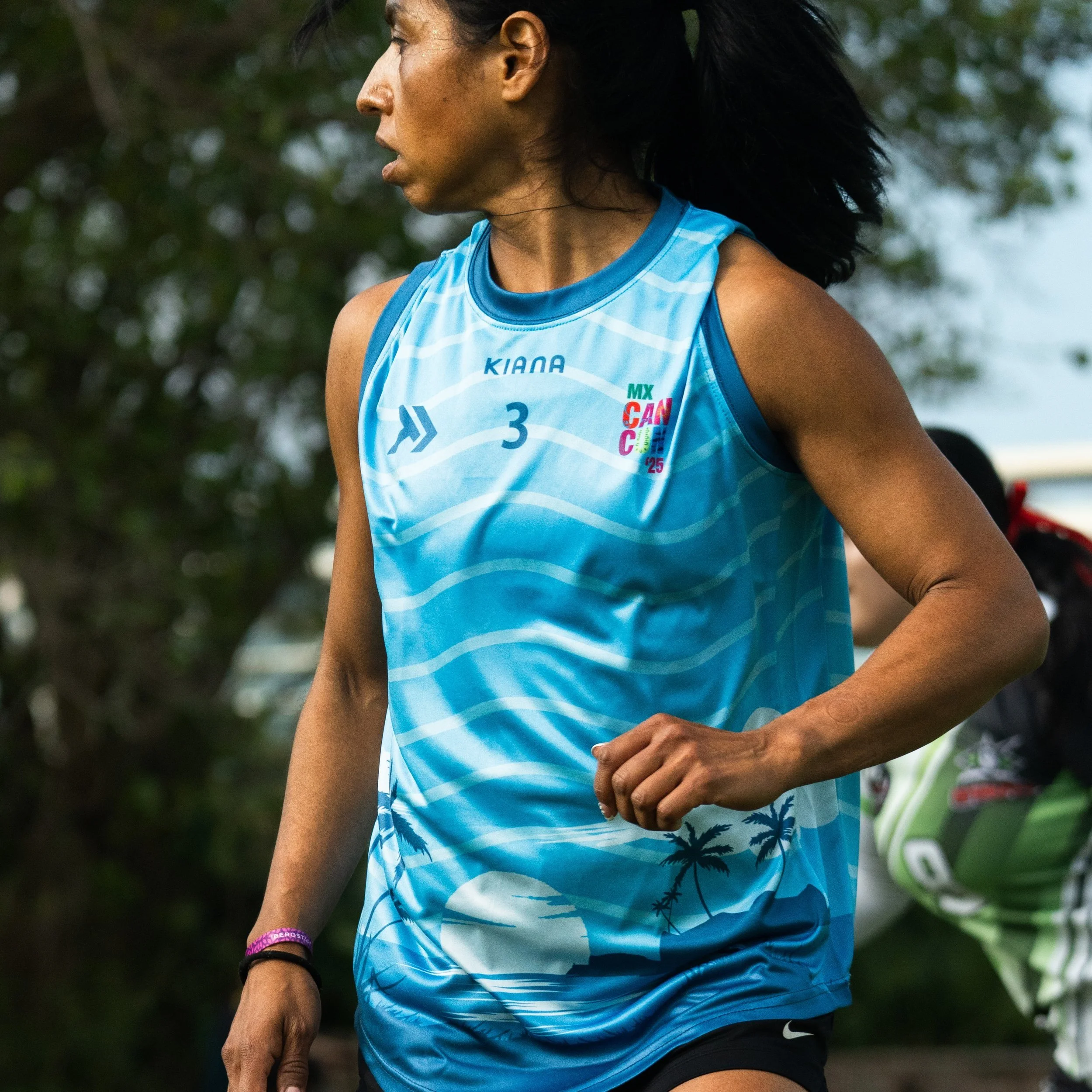 Kiana athlete in cyan training tank