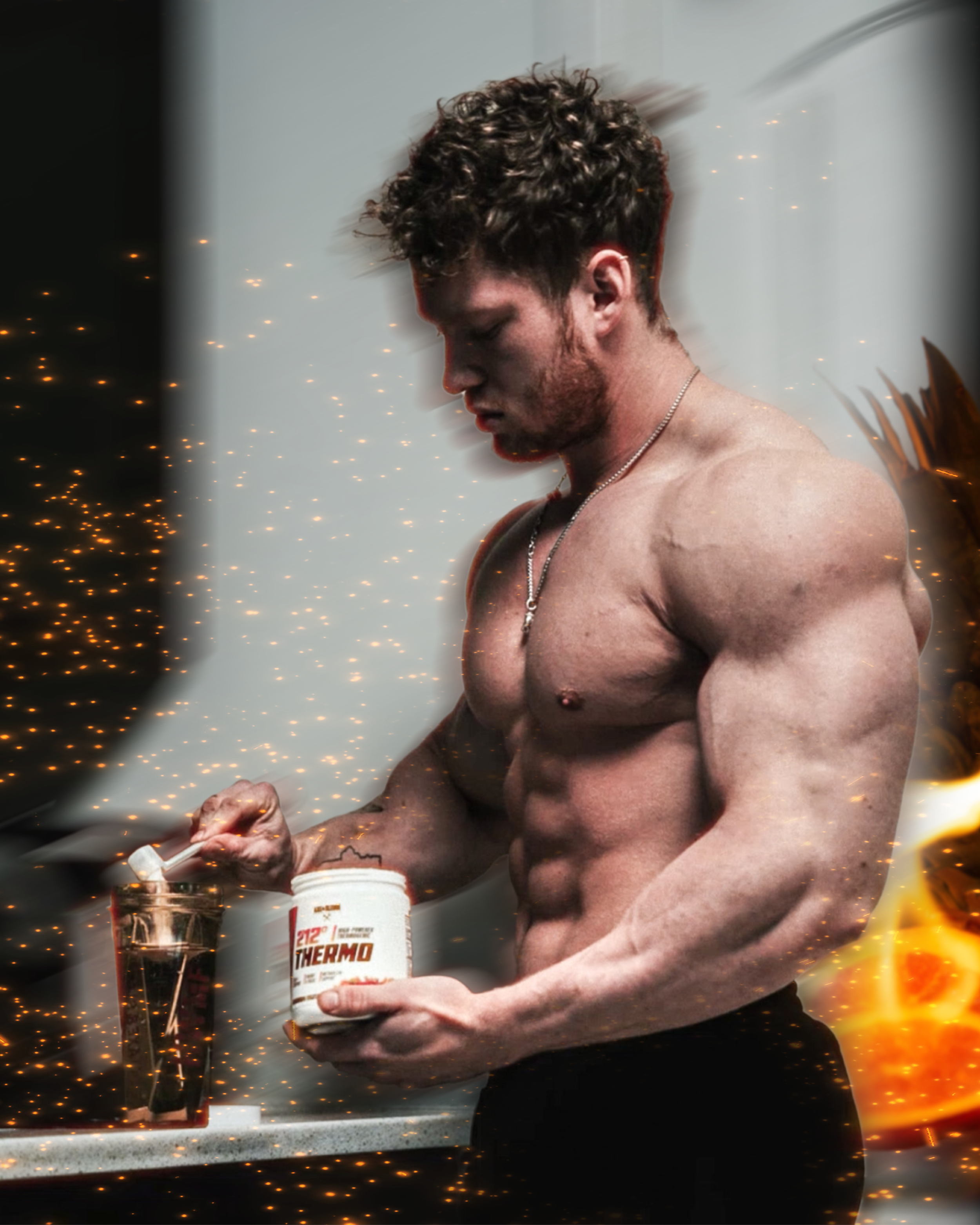 A muscular, shirtless man with curly hair and a beard standing in a room with sparking lights or effects around him. He is holding a container of Thermo supplement and pouring a powder into a measuring scoop.