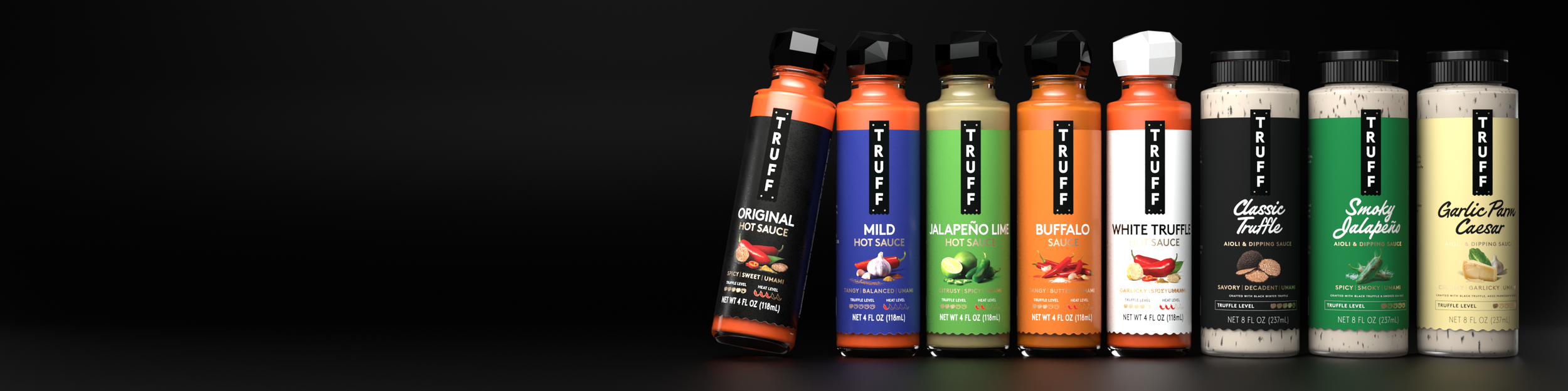 A row of various Truff hot sauce and dipping sauce bottles against a black background.