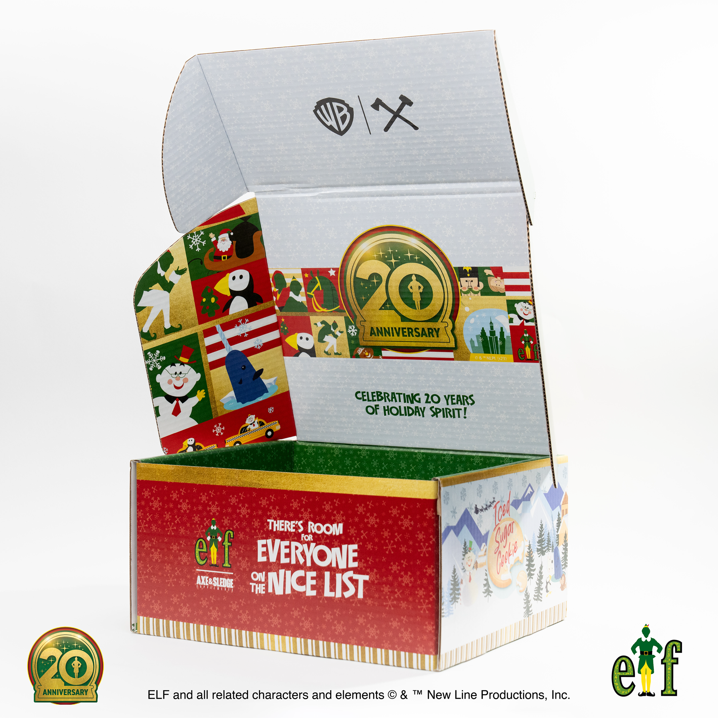 An open holiday-themed cardboard box celebrating 20 years of holiday spirit, featuring various festive illustrations and logos, including ELF and a 20th anniversary badge.