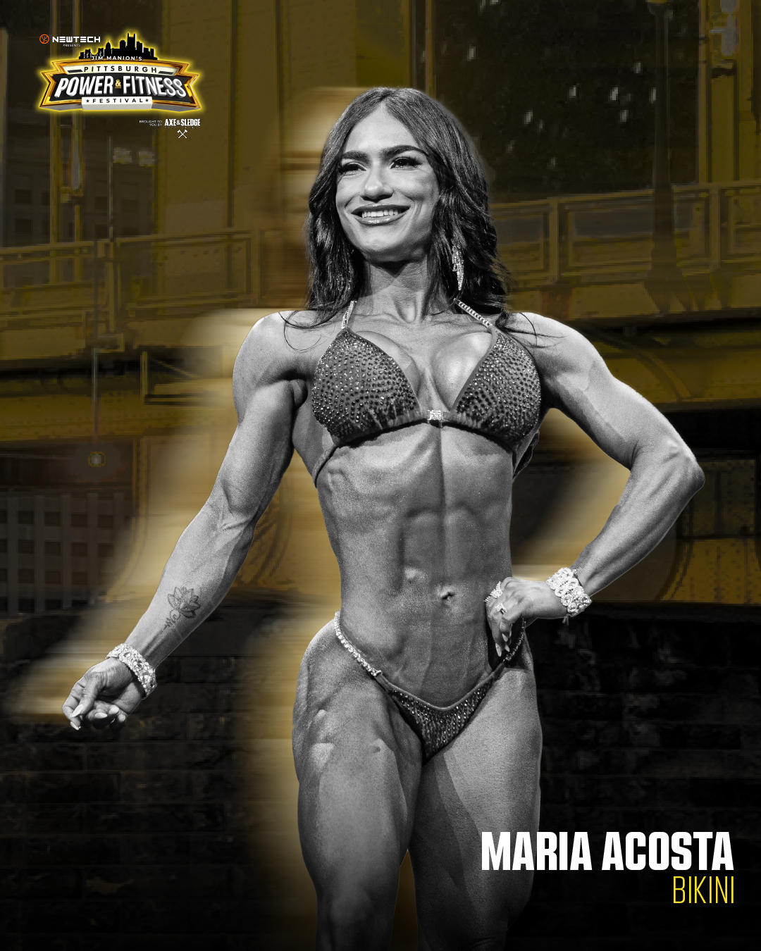 Black and white photo of Maria Acosta in a bikini on stage during a bodybuilding competition, with event branding and logos in the background.