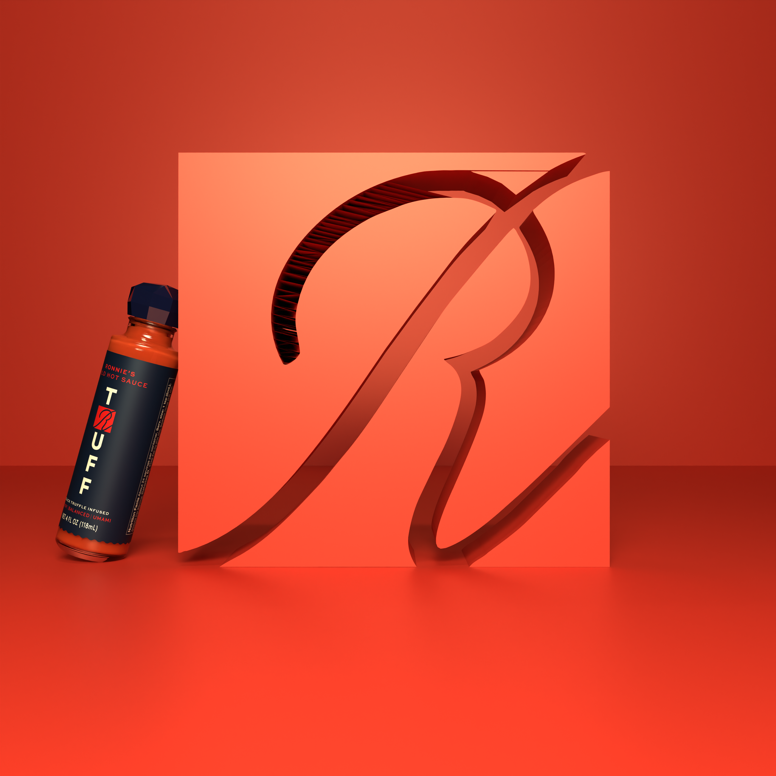 Close-up of a hot sauce bottle with a colorful background and a stylized 'Q' in the center.
