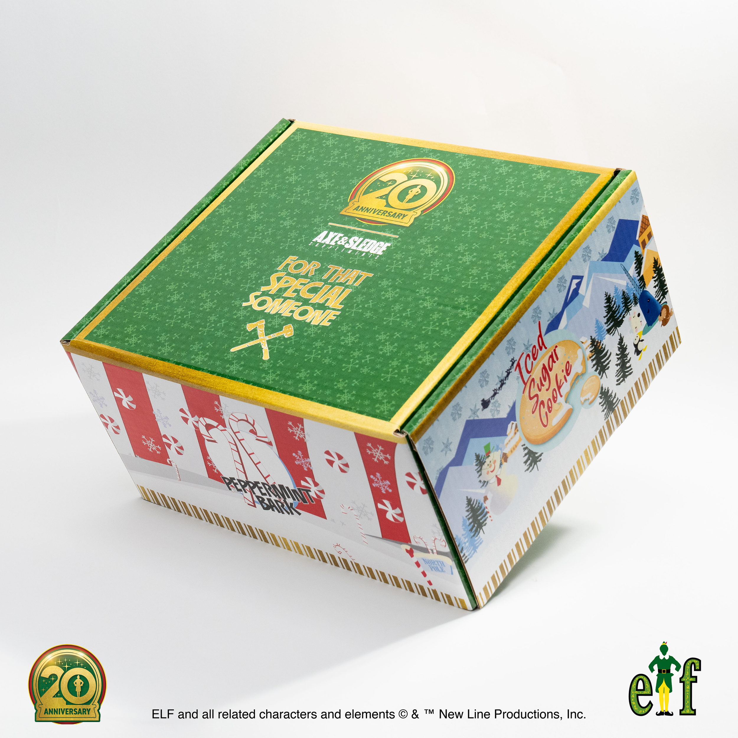 A decorated holiday-themed box with a green top featuring the 20th anniversary logo, and sides with Christmas imagery including peppermint candies, snowmen, and winter scenes labeled as 'Iceed Sugar Cookie' and 'Peppermint Park.'