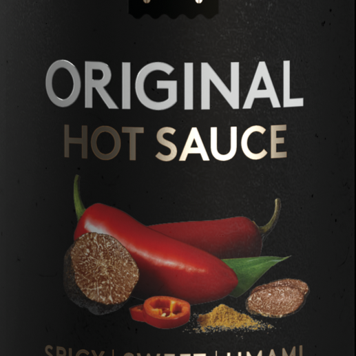 Hot sauce bottle label with red chili pepper, lemon, and various spices.