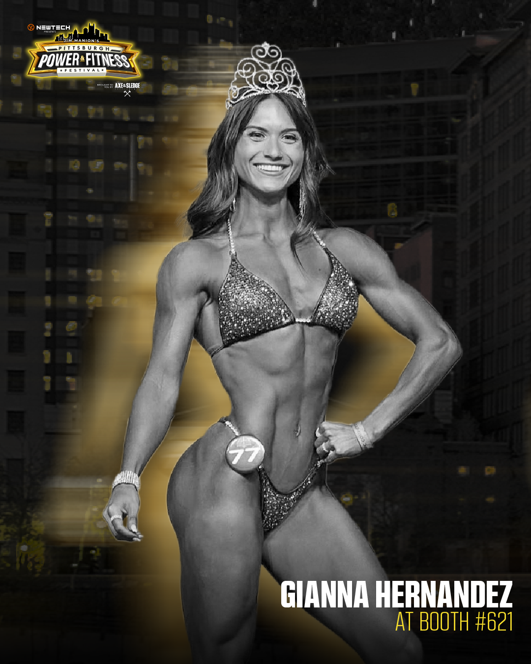 Black-and-white photo of a female bodybuilder in a competition, wearing a sparkly bikini and a sash with the number 77, smiling and striking a pose. The background is a cityscape at night with the logo of a power and fitness festival in the top left corner, indicating the event is in Pittsburgh.