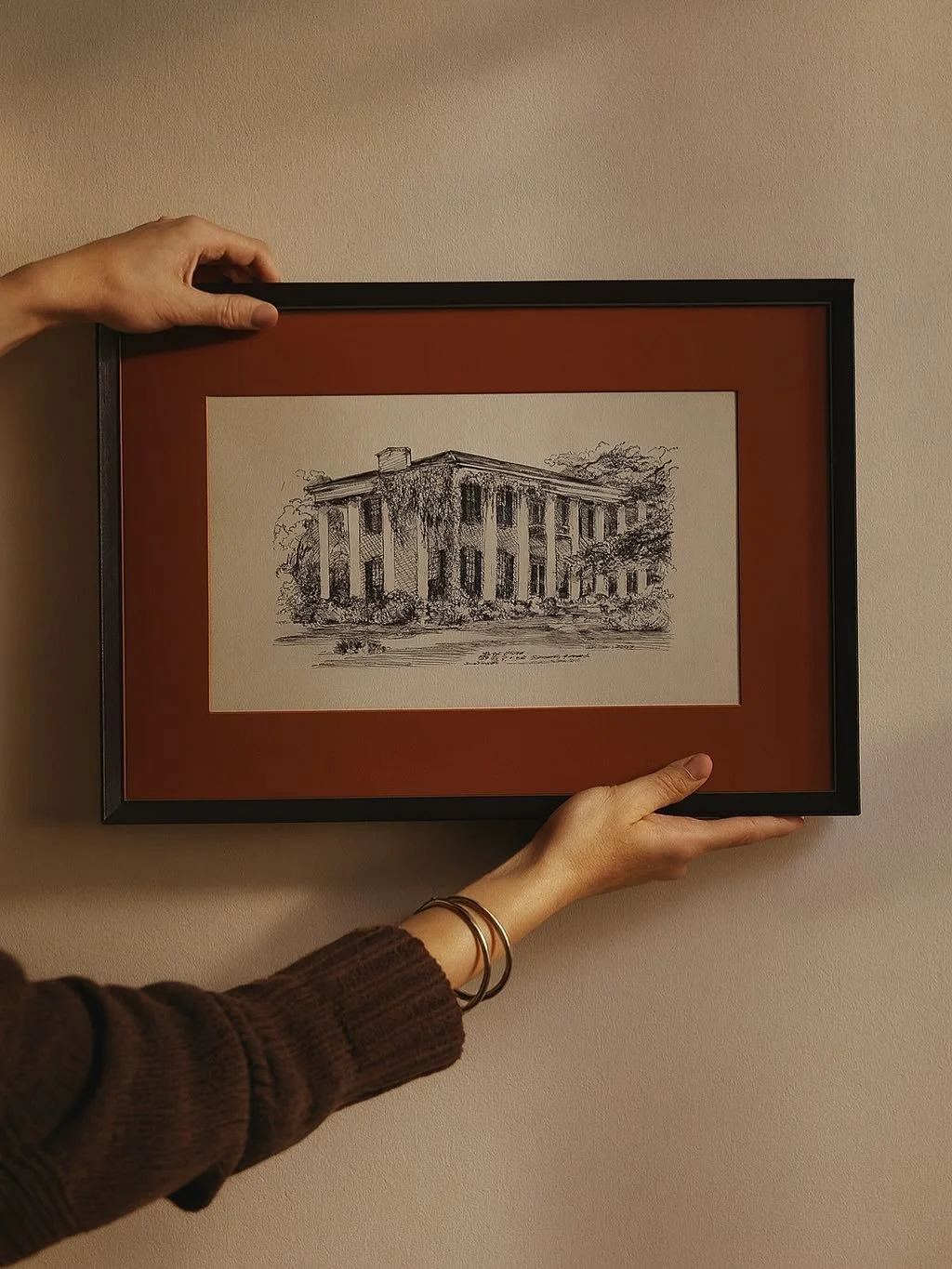 A timeless Set of Two Framed Black Ink Sketches by Richard Brough &mdash; featuring two beloved Tuscaloosa landmarks: the University Club and the Dearing Swaim Home. 

Each finely detailed architectural rendering captures the quiet elegance of Southe