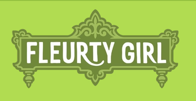 Green logo with ornate decorative borders and the text "FLEURTY GIRL" in bold white letters.
