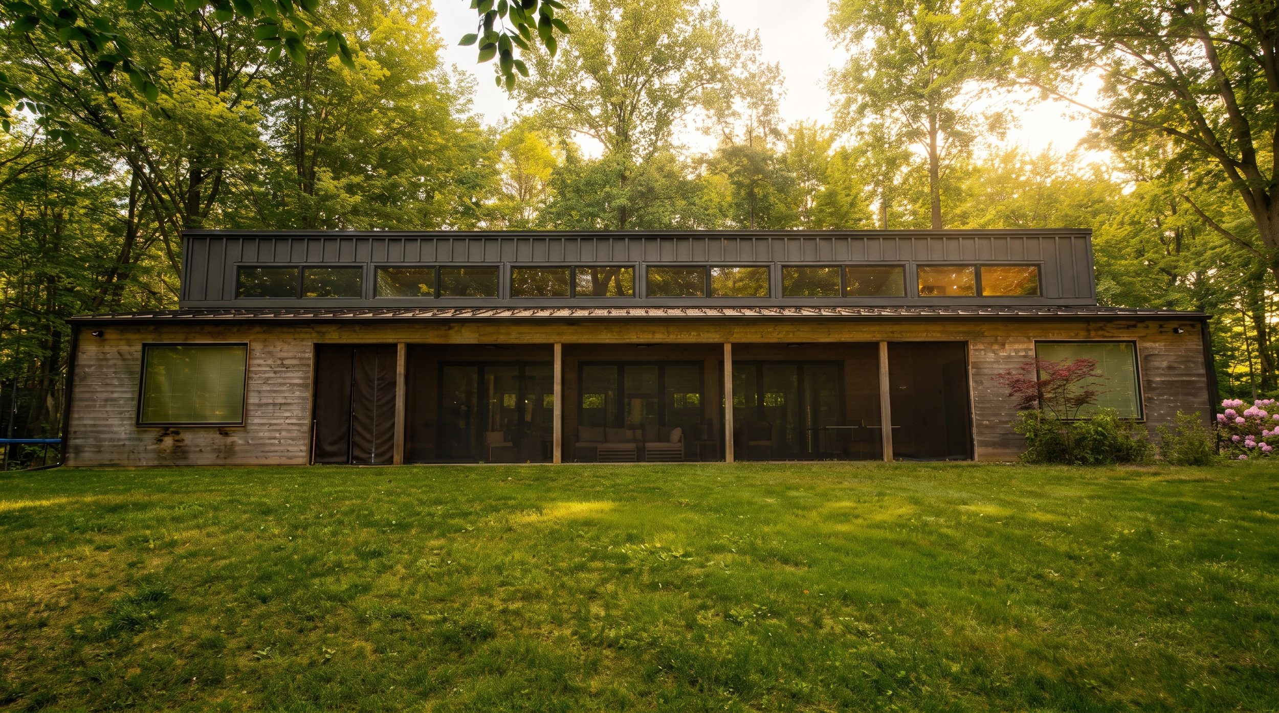 Front view of the screened porch and clerestory windows at Lake Effect Cabin