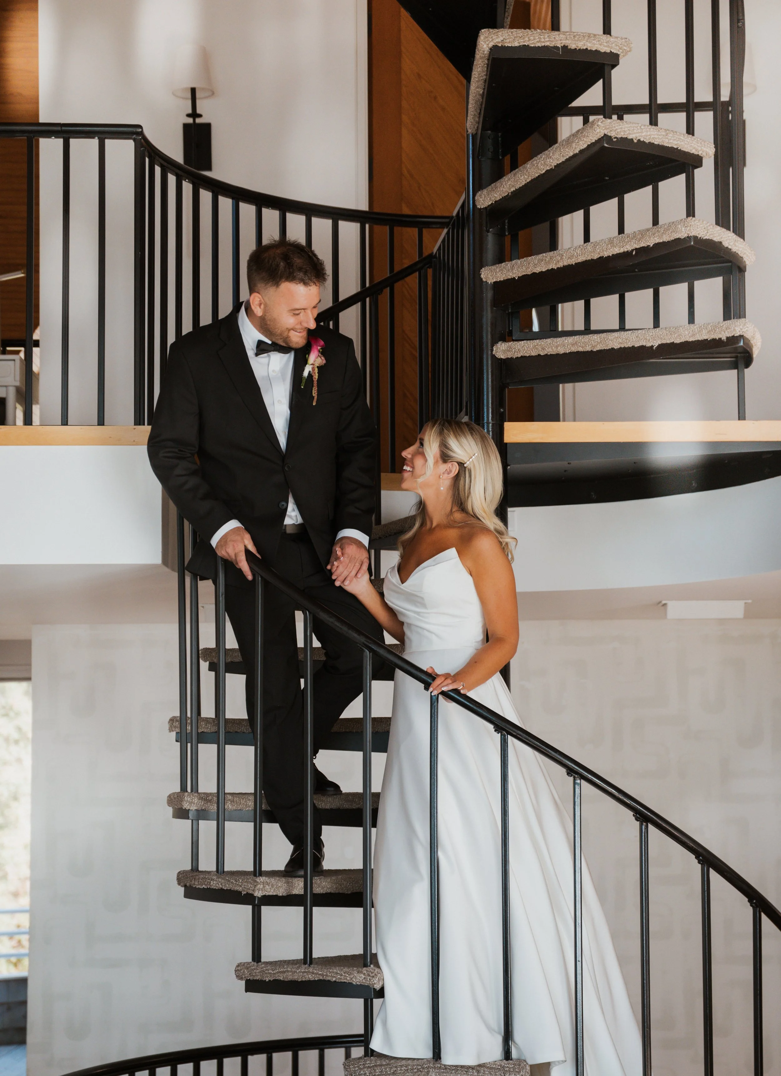 Bride and groom on the spiral staircase at a Lighthouse Bluff wedding