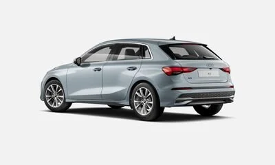 Silver hatchback car shown from the rear and side view