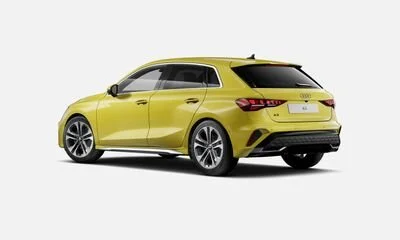 Yellow hatchback car viewed from the side against a white background.