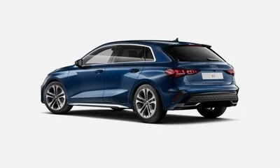 A blue modern hatchback car viewed from the side and slightly rear angle.
