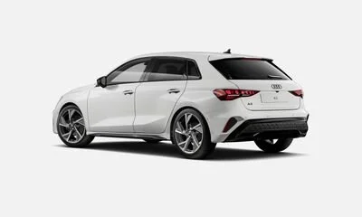 White Audi station wagon car viewed from the rear three-quarter angle.