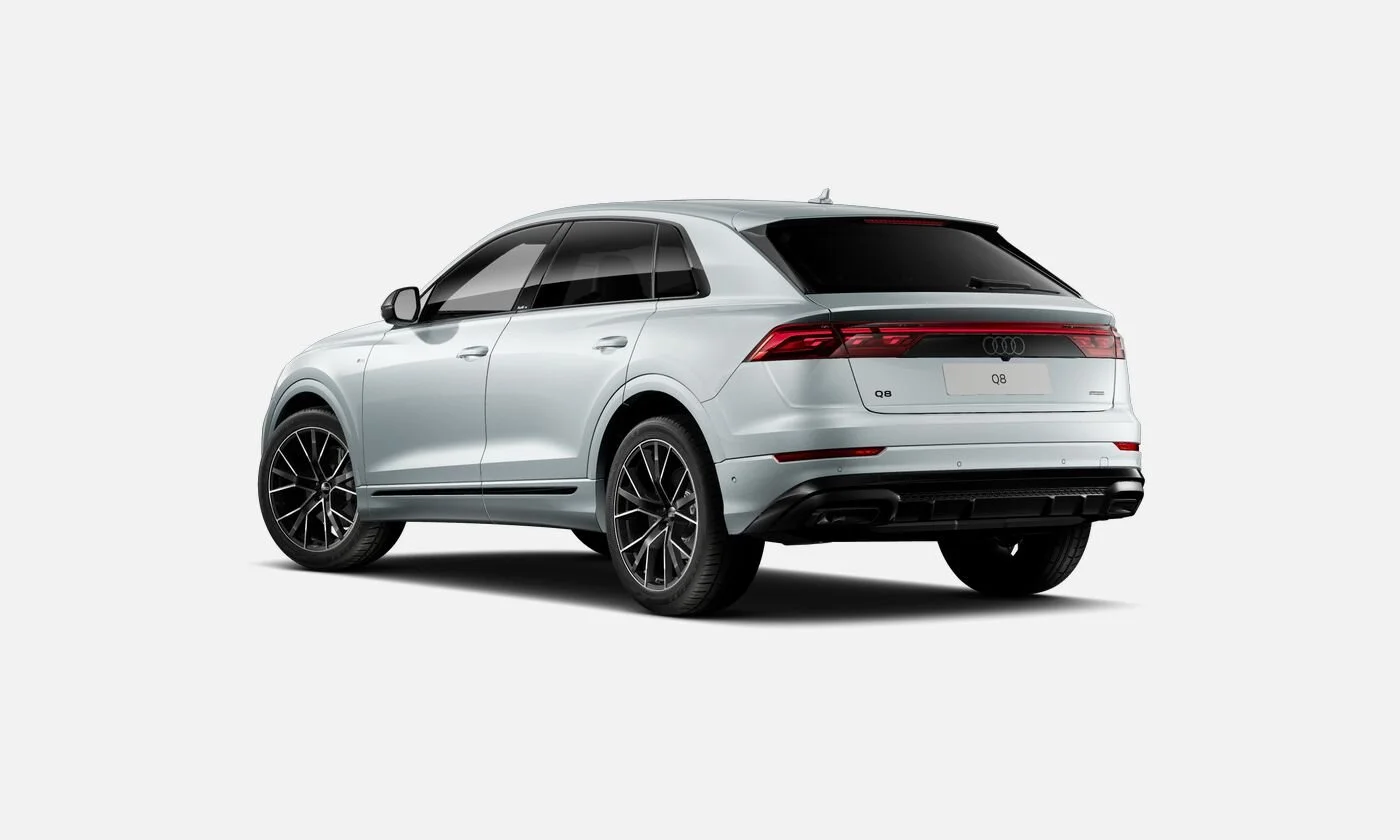 A silver Audi Q8 SUV viewed from the rear-left side on a plain white background.