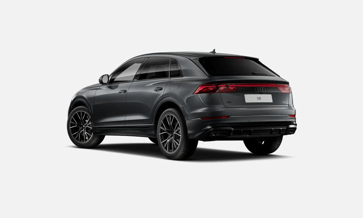 Black Audi Q8 SUV viewed from the rear on a plain white background.
