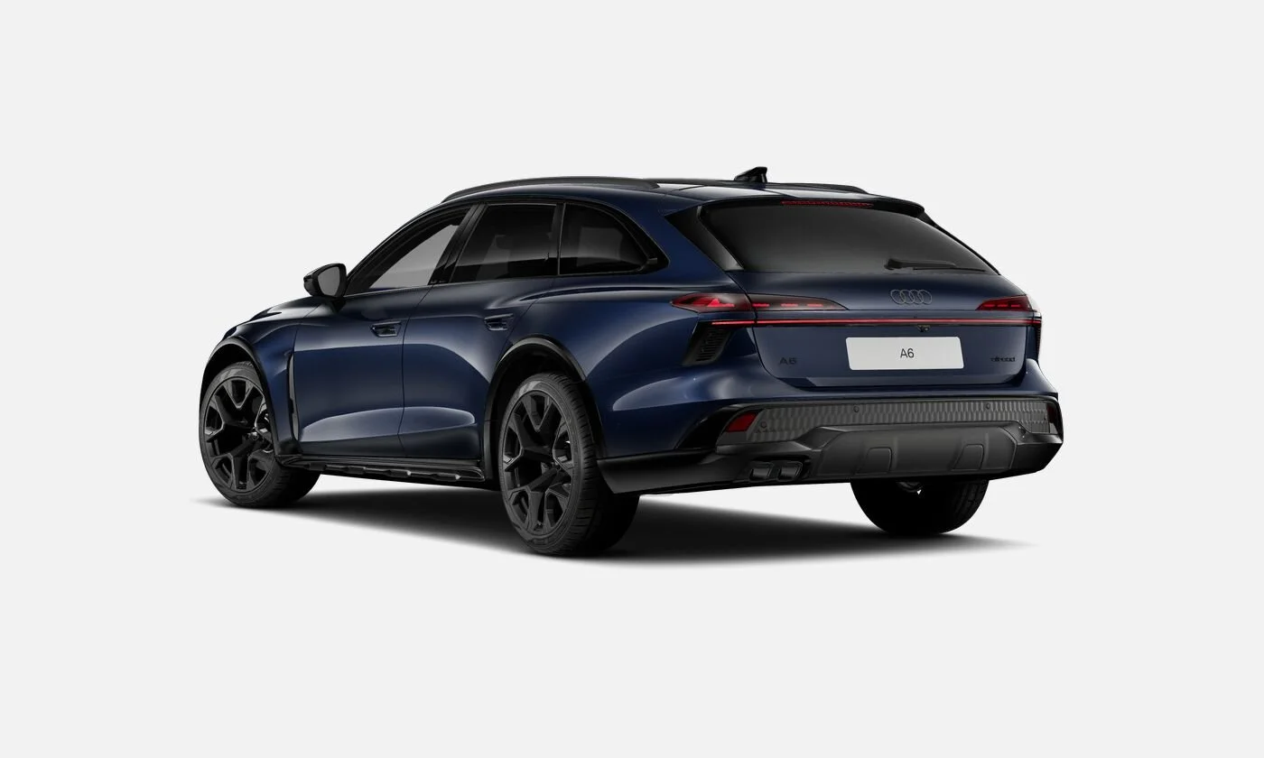 Rear view of a dark blue Audi A6 station wagon with black wheels, tinted windows, and sleek design, set against a plain white background.