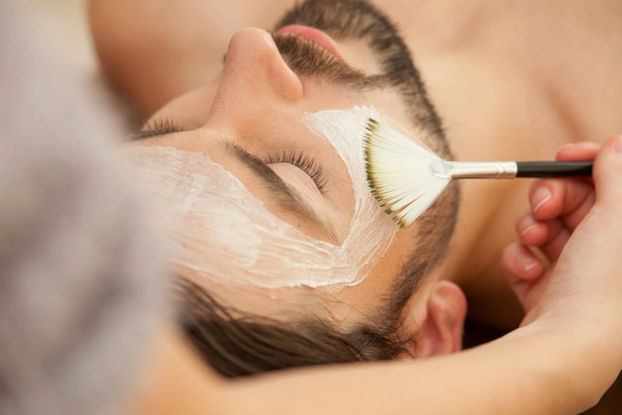 Professional facial treatment for men at Verni Beauty salon in Seattle.