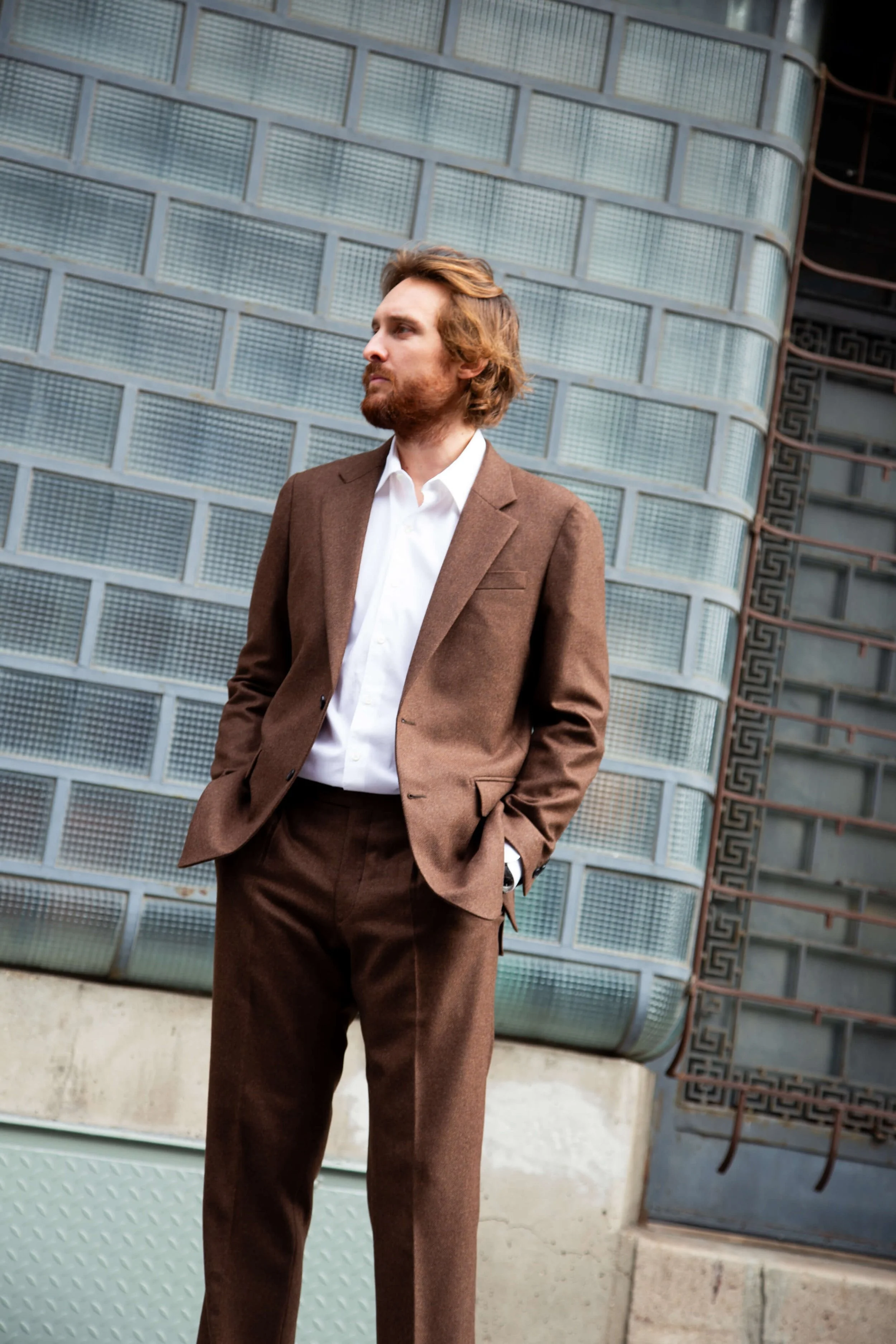 Brown wool cashmere loro piana flannel mens custom 2-piece suit with unconstructed shoulders and a Neapolitan sleeve cap with straight leg pants. 