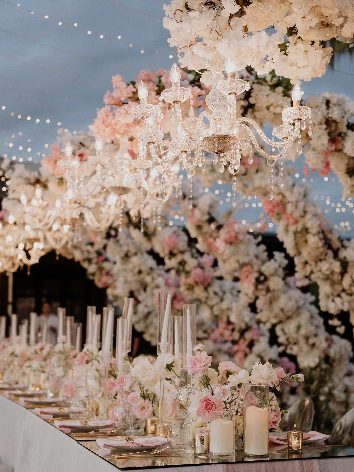 We designed this space to shift from day to night, inviting our guests into a different kind of beauty as the sun went down. What started as a bright and romantic setting for the wedding ceremony transitioned into a warm and intimate atmosphere for d