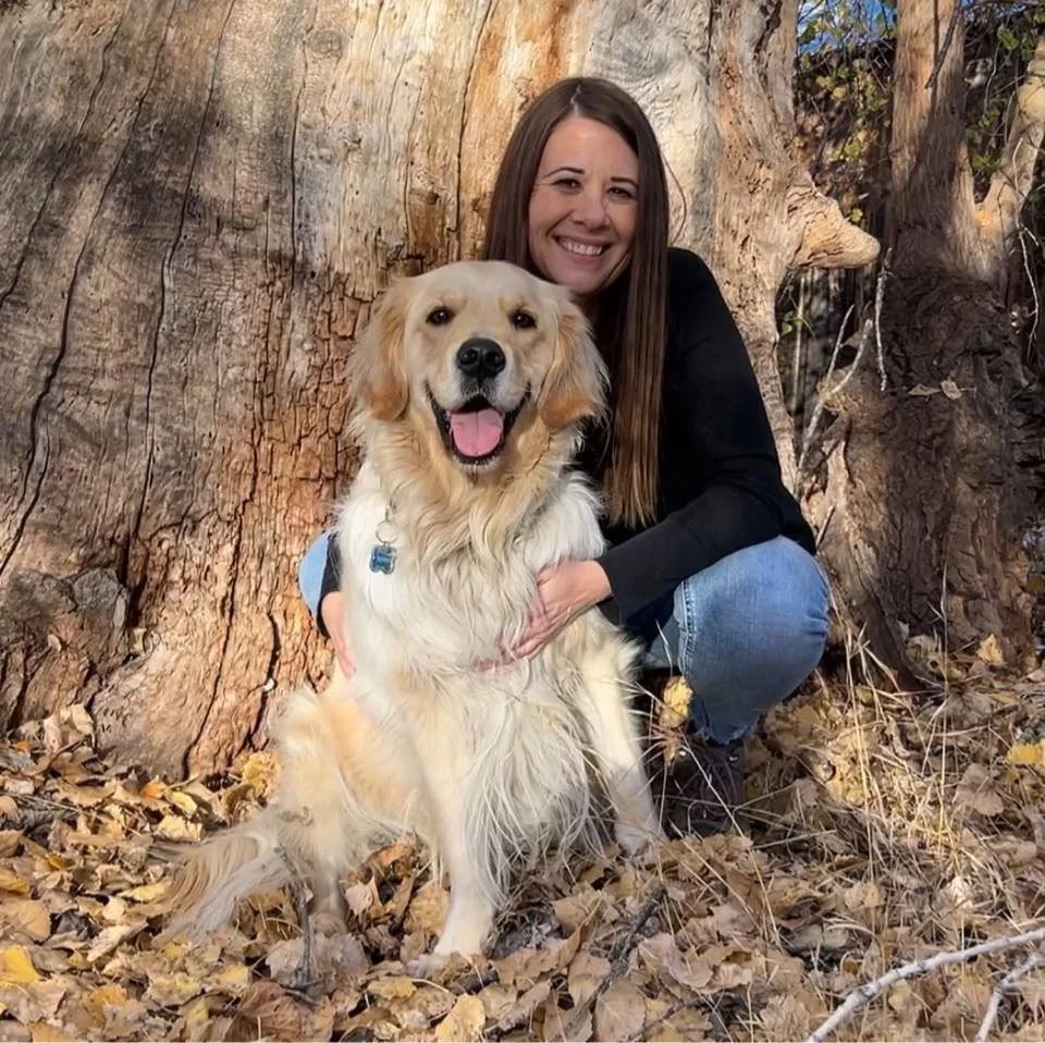 Kim, ketamine integration coach, with her dog, symbolizing compassion and grounded healing