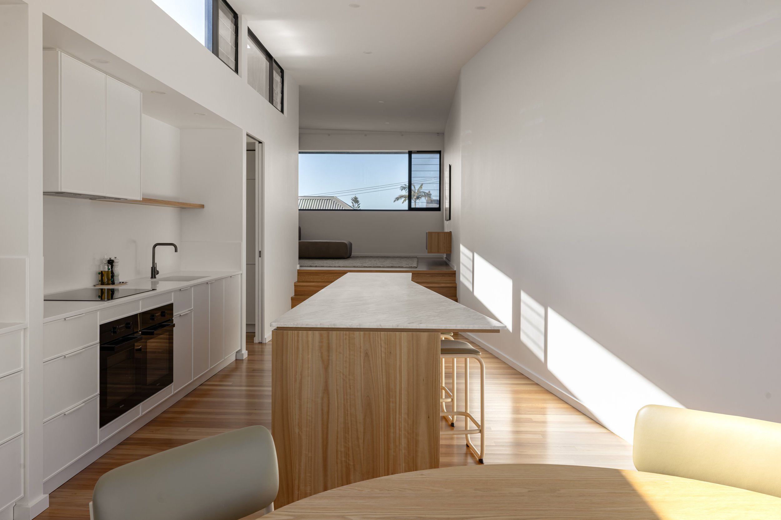 The Hill kitchen island looking through to living and panoramic window.