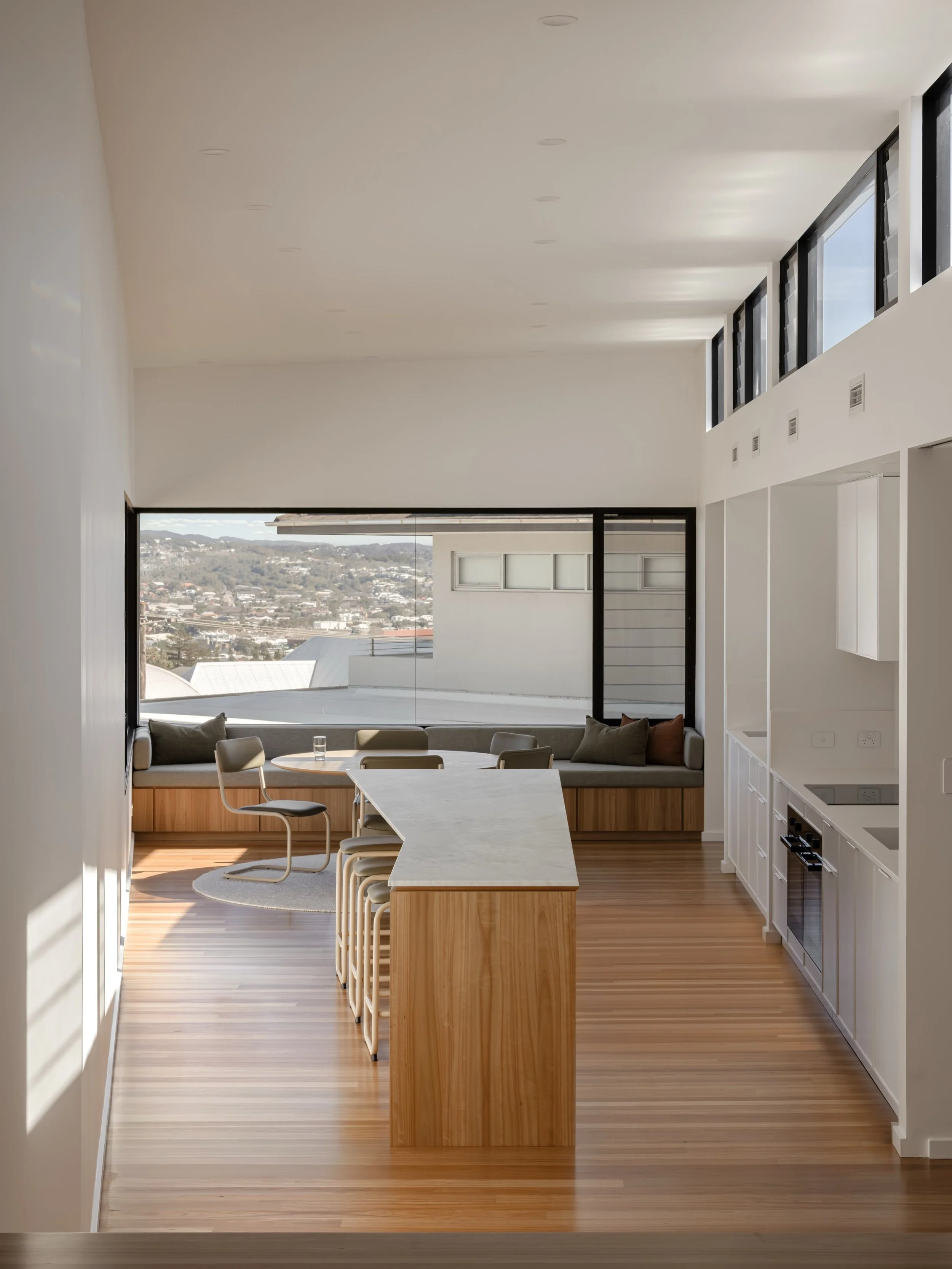 High Street, where the view becomes part of the home.
Warm timber, natural stone and a restrained palette create a calm interior, while expansive glazing draws in light and frames the outlook beyond.
A considered home that makes the most of its eleva