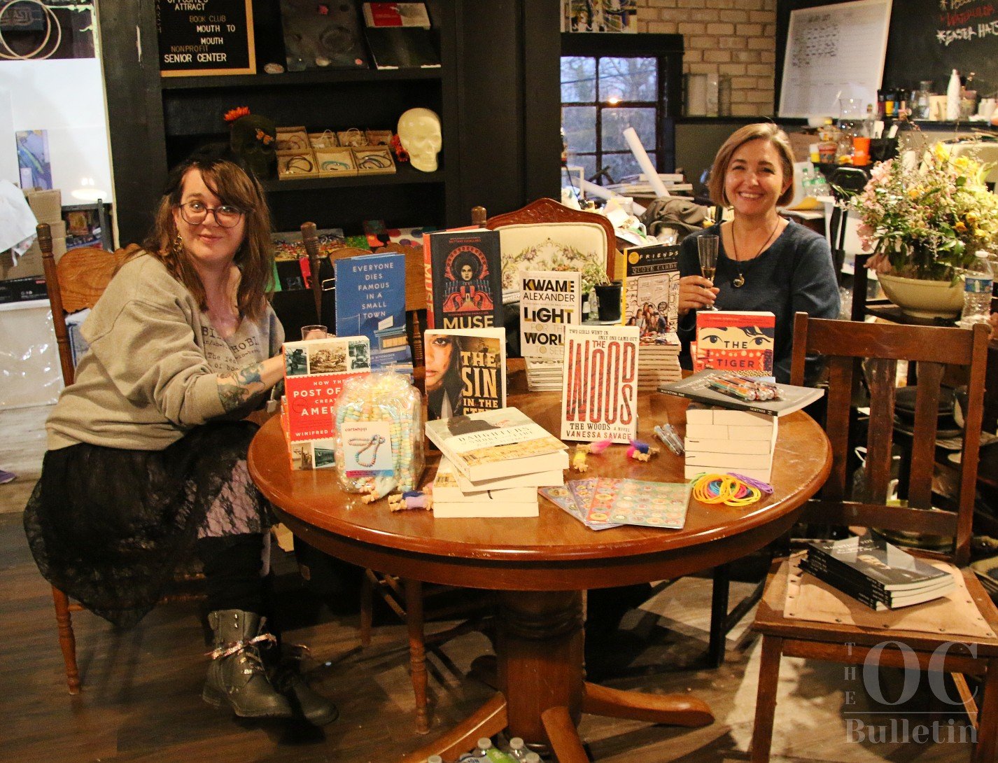  Pictured, left to right: Heather Griffin and Cindy Pagan, owners of Spelled Ink bookstore and founders of the Orange Literary and Arts Convention. (Photo Credit: Andra Landi) 